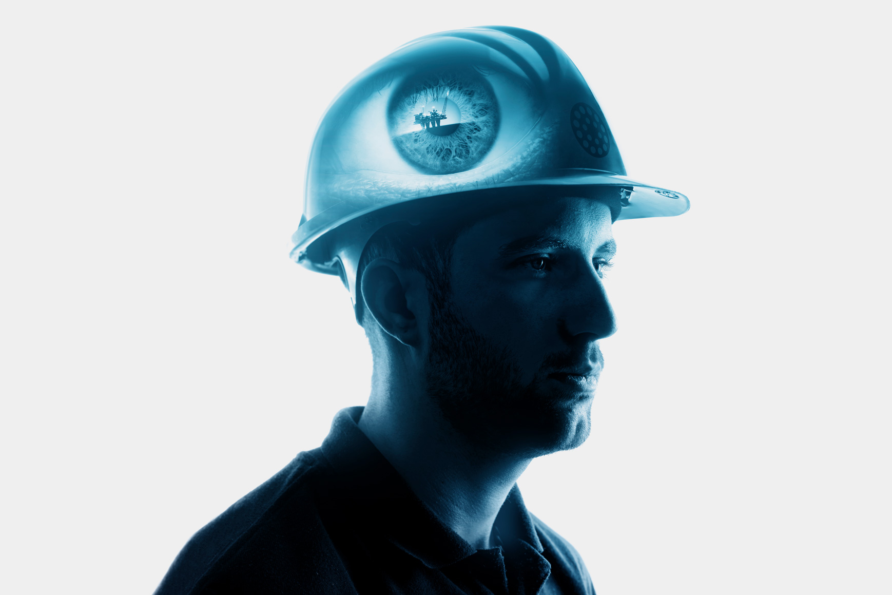 Hero brand image showing man with hard hat with an eye superimposed into the side of the hat.