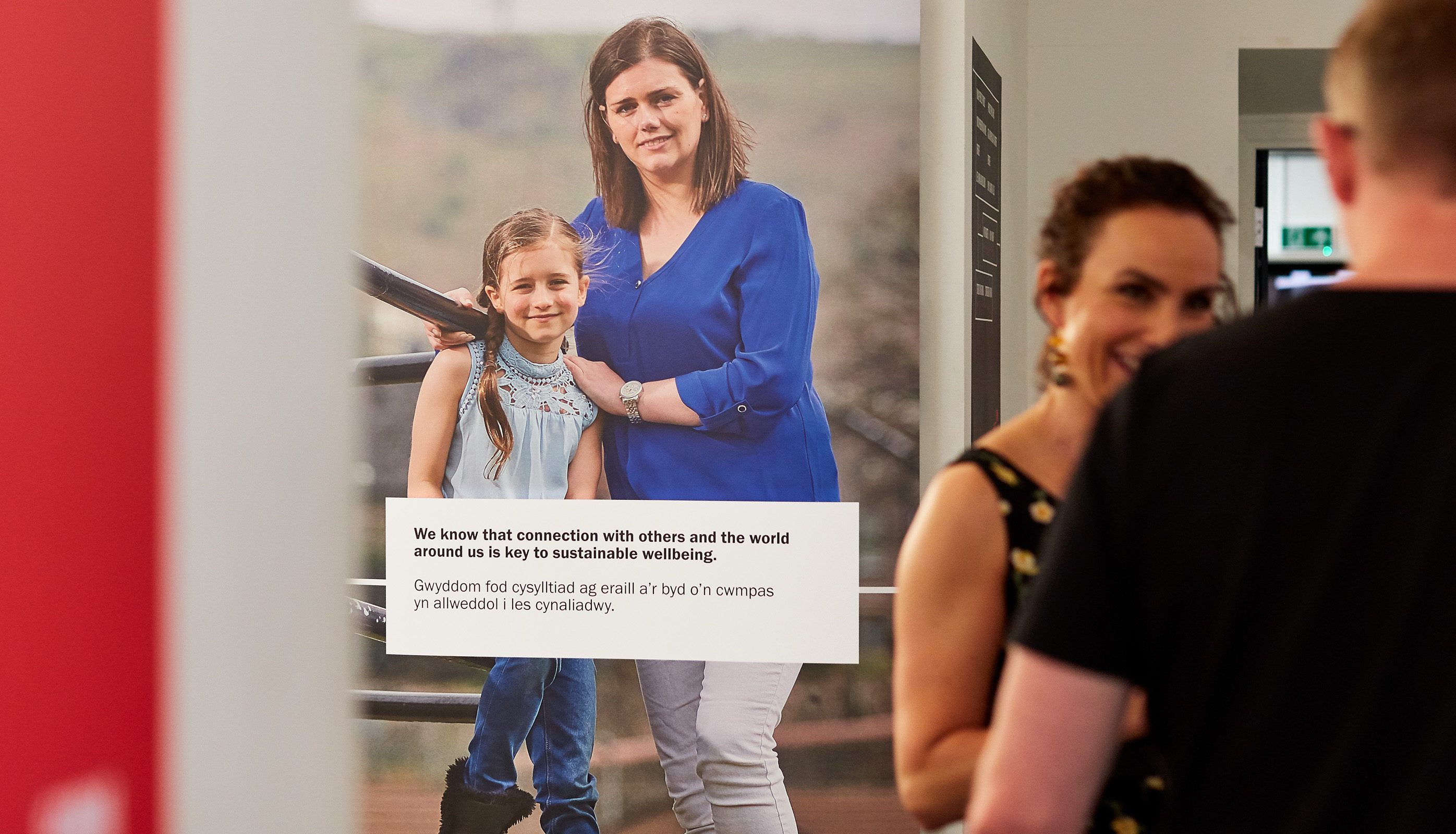 Image showing branded charity event stand amongst guests