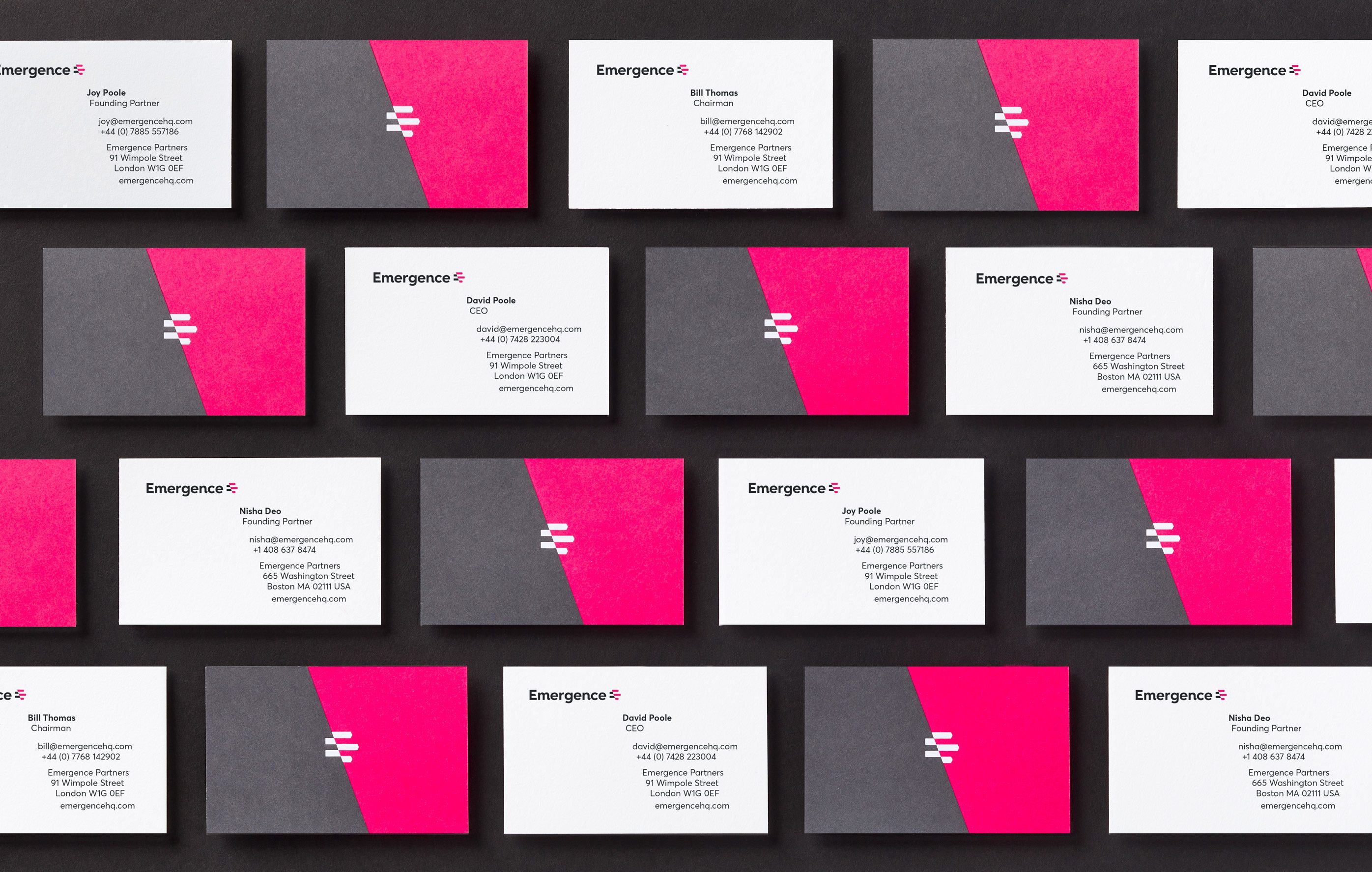 Business card designs lined-up against black background