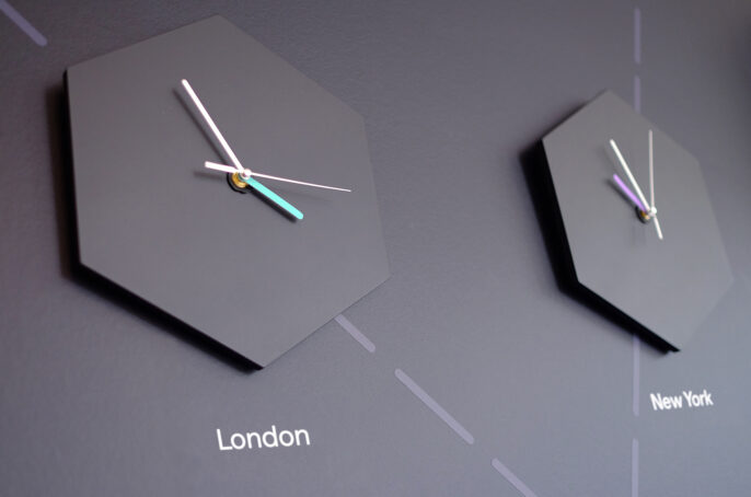 Bespoke branded clocks on wall in corporate office